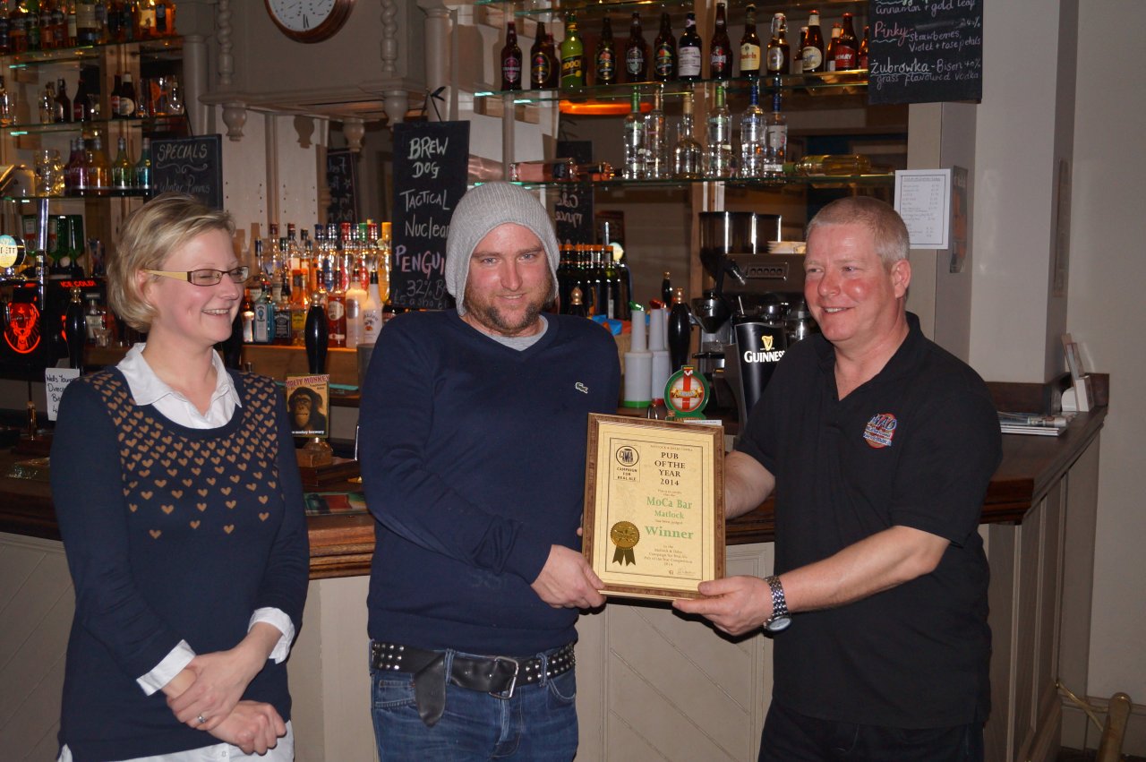 New chair Graham Dawson presents certificate to Sharne Castle and Paul Moseley