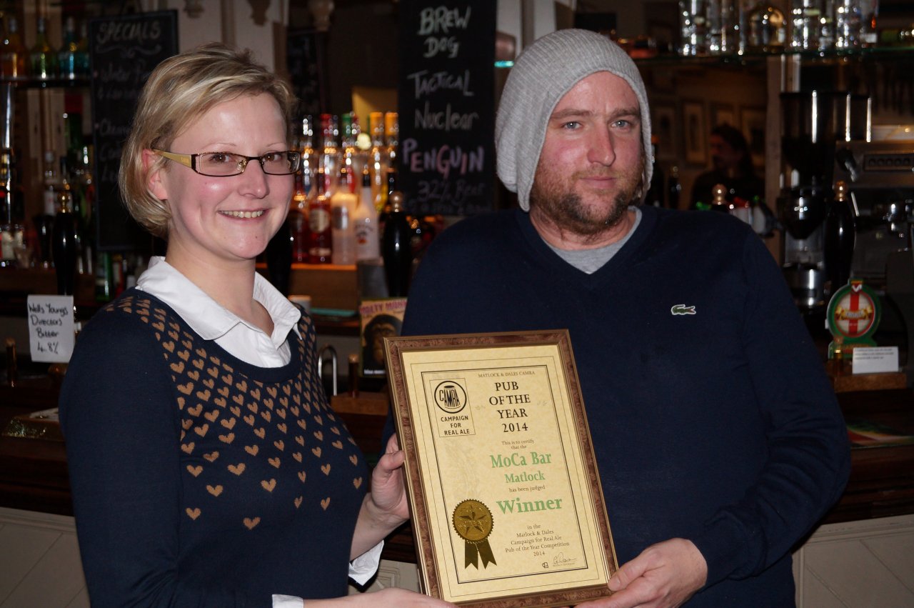 MoCa owners Sharne Castle and Paul Moseley show off the MAD POTY 2014 certificate