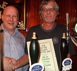 Dave Smith (left) takes the Award from Chairman John Cryne. This small street corner pub has taken great steps to improve real ale on Green Lanes.
