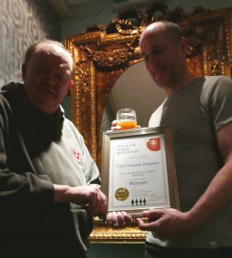 Branch Chairman Colin Coyne (left) presents Paul Evans with the Award.