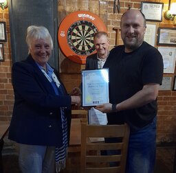 Branch member Susan Holford presenting Rutland CAMRA’s 2022 Pub of the Year award to Peter Atkinson of The Grainstore Brewery Tap