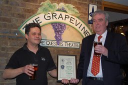 John Webster of Questors Grapevine Club accepts CAMRA's 2012 National Club of the Year Award from CAMRA's John Holland (right) in a night of celebration in Ealing.