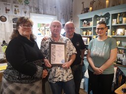 Vice-Chair Jackie hands the Town Pub of the Year certificate to Steve Williams and the team at Deeping St James' newest pub, the Thirsty Giraffe 