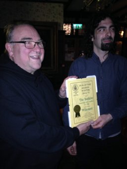 Ian McLaren (CAMRA left) presents Alex Abyad with the Beehive's Award. 