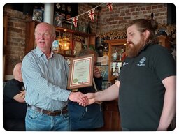 Presentation of Award to Our Gracie’s Rochdale Cider POTY 15 May 2026, by Cider & Perry Rep and Deputy Chair, Mike Robinson, to Kieran, bar Manager.