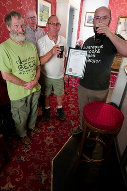 Alex Douglas is presented with the certificate for Subterfuge which won a finalist award in the milds category in the Champion Beer of Britain awards 2026. Presenting the certificate is Stuart Johnson, their BLO and Dave WIlson representing Furness CAMRA at the White Lion, Barrow.