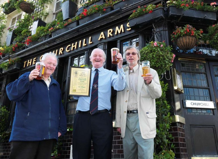 Churchill Arms is West London's Pub of the Year from left to right Les Maggs (W London) Gerry O'Brien (Churchill Arms) John Cryne (CAMRA London)