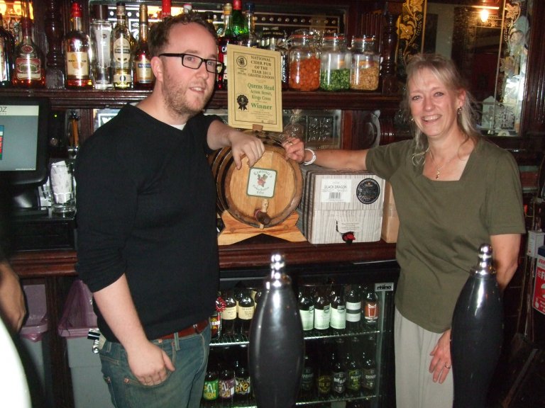 Nigel Owen (left) at The Queen's Head, Acton St., accepts the 2013 Greater London Cider Pub of the Year Award from CAMRA's Christine Cryne.