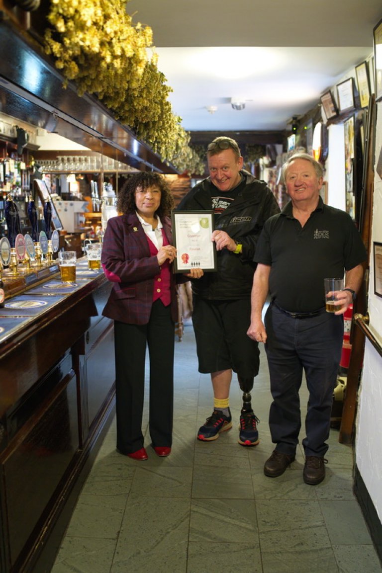 Ian Bradley of Coniston Brewing Co. receiving the Certificate for Coniston No. 9 Barley wine as a Finalist in the 2019 Champion Bottled Beer of Britain Awards from CAMRA Regional Director, Angela Aspin and Furness Branch Chairman, Dave Stubbins.
