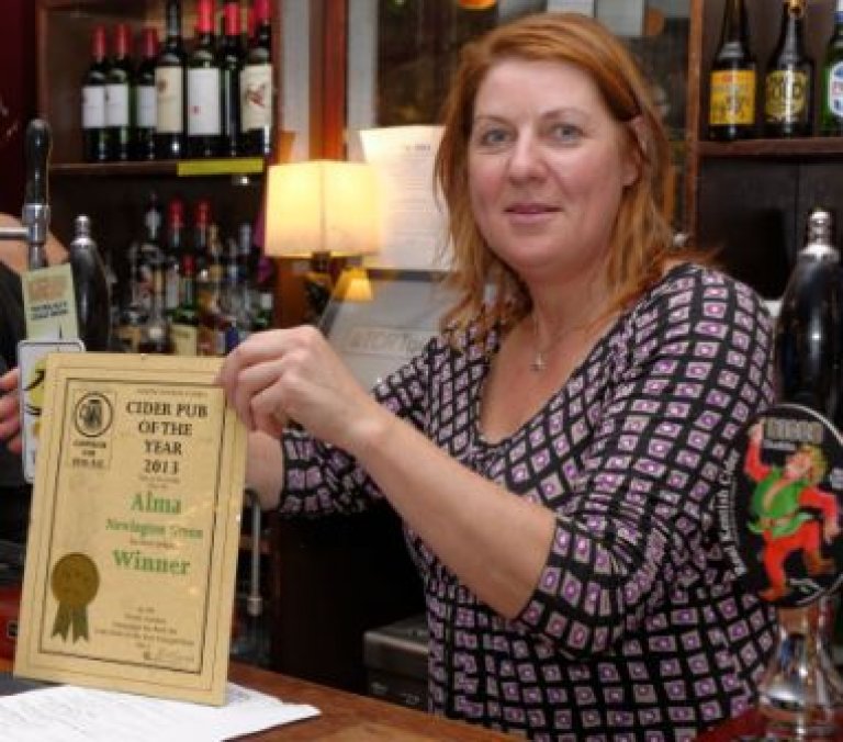 Landlady Kirsty Valentine shows off the Award