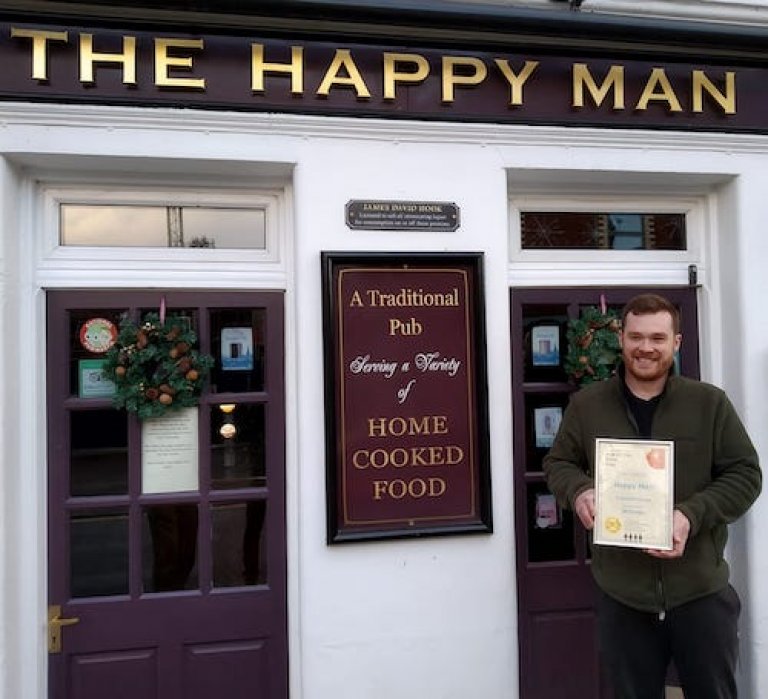 Landlord James pictured outside his locked down pub December 2020