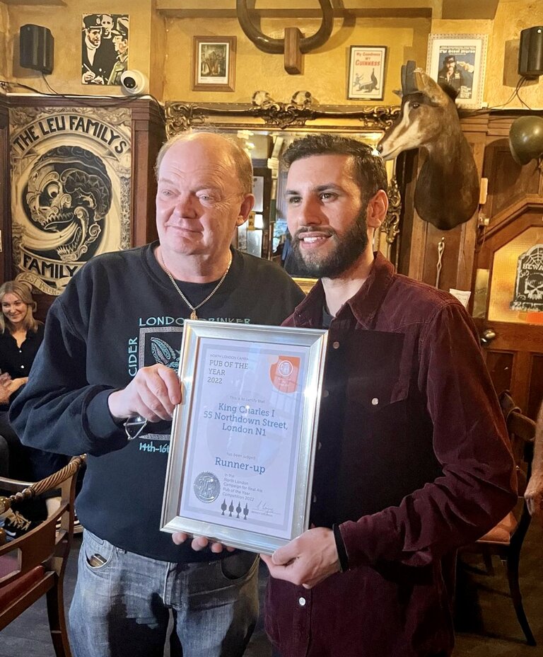 Pub Manager Ayub Wade (right) accepts the Award from Branch Chairman Colin Coyne.