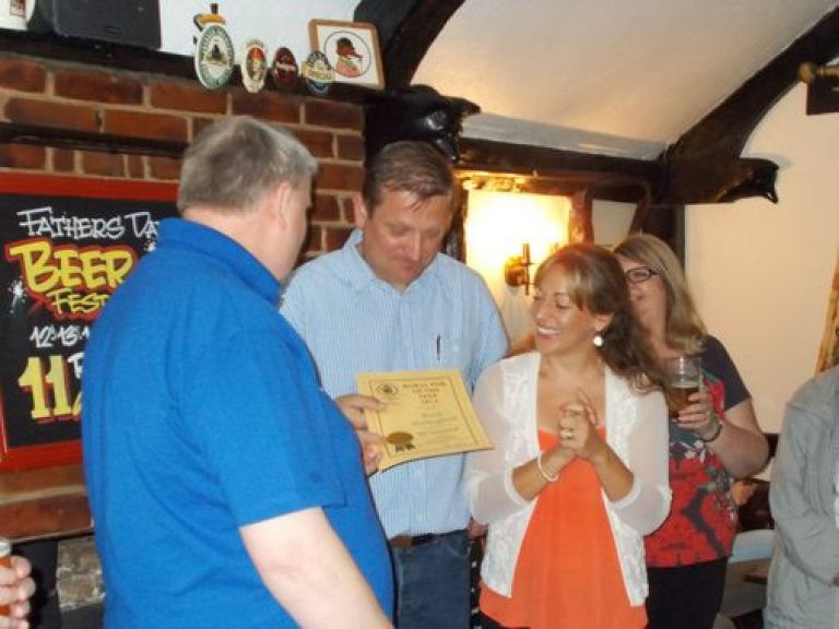 Mike Davey presents Matt and Jemma Mills of the Shadingfield Fox with NE Suffolk's Rural Pub of the Year