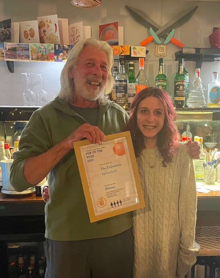 CME Chair Norman Robinson presents the branch Pub of the Year 2023 Award to Naomi Hammett of the Endeavour, Springfield