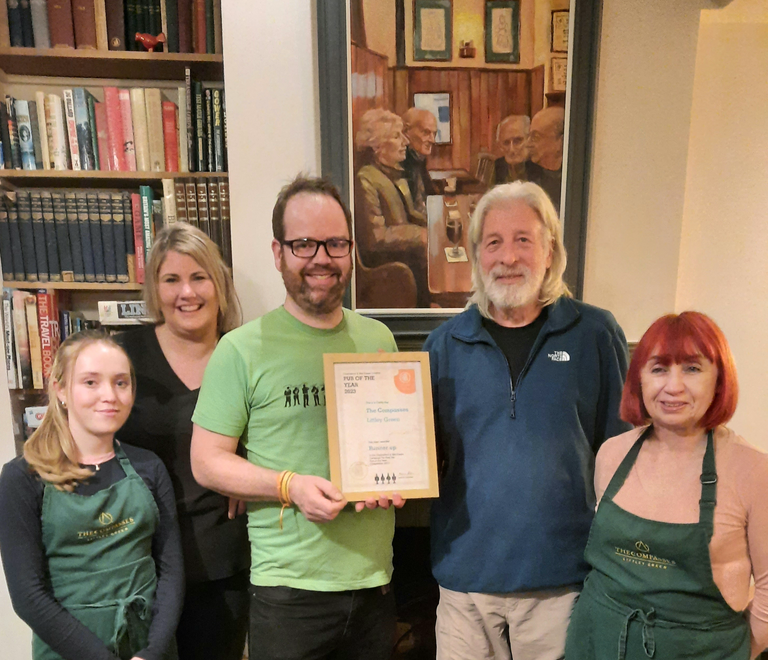 CME Chair Norman Robinson presents the branch Pub of the Year Joint Runner-up 2023 Award to Joss Ridley and Staff of the Compasses, Littley Green