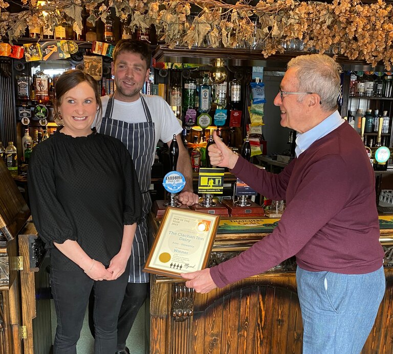 Keith Bruce presenting the Clachan Inn, Dalry, with their POTY certificate