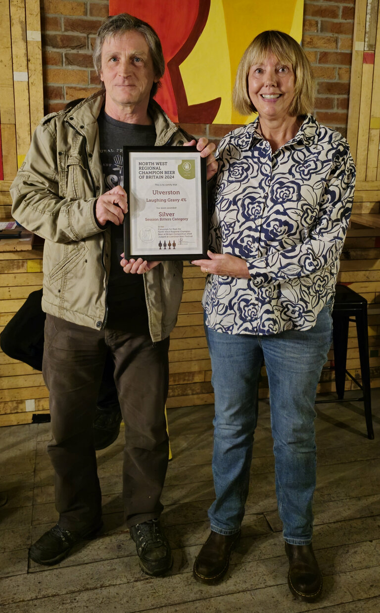 Paul (Ulverston Brewing) being presented with the certificate for Silver award for Laughing Gravy as the NW Region Champion Beer of Britain (Session Bitters) by Furness CAMRA's Julie Kirkham