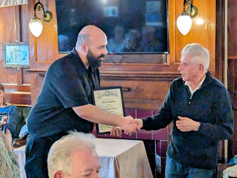 Wayne accepting the award for the Templar.