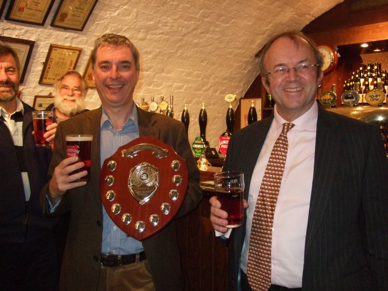 John Keeling holds the John Young Memorial Award Shield presented by Torquil Sligo-Young, right. 