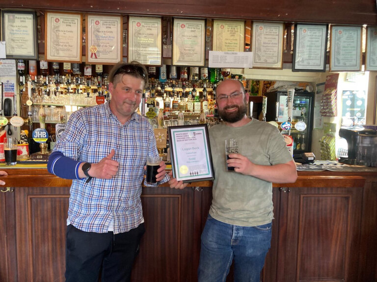 NW Merseyside and Cheshire CAMRA Champion Beer of Britain 2025 Gold Award for Logan Beck Subterfuge in the Mild Category. Alex Douglas receives the certificate from Malc Armstrong (CAMRA) at The Manor Arms, Broughton.