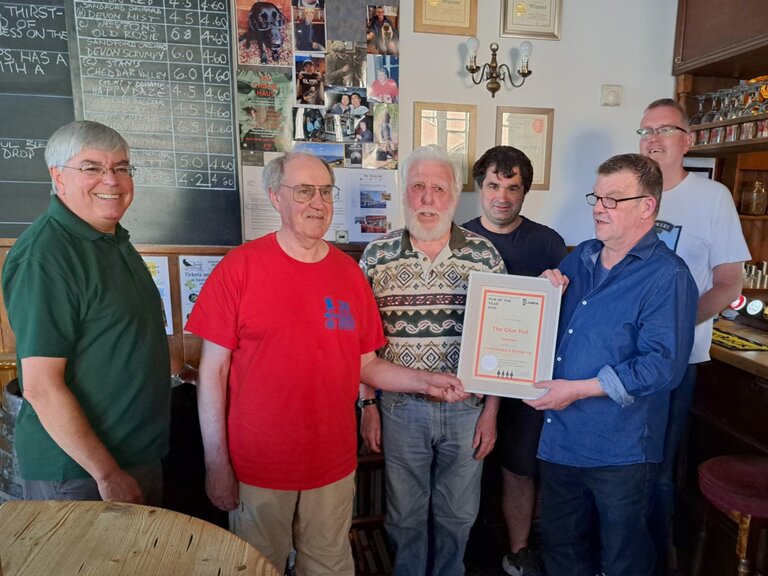 Glue Pot landlord Mark is presented with the Cider Pub of the Year certificate.