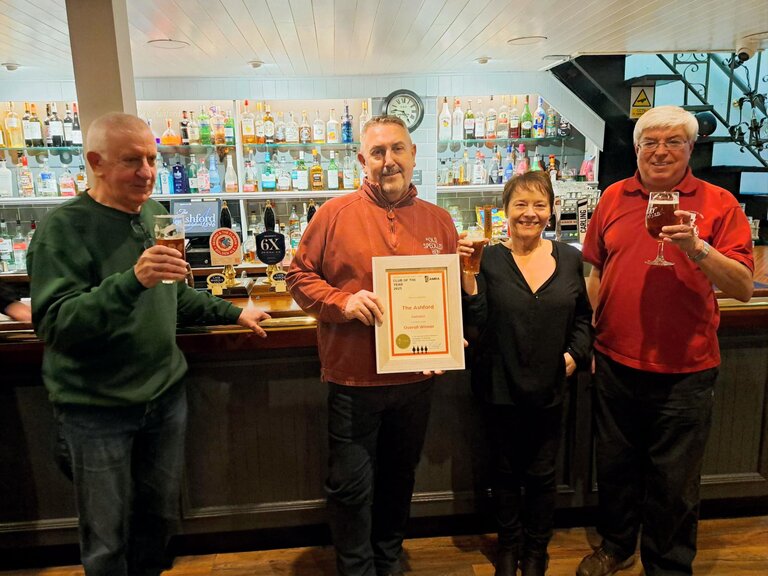 Clubs Officer Paul New and Secretary Richard James toast Malcolm & Jennie Brownlee.