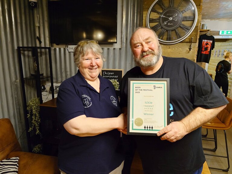 Stu Betts receives his award from Shelly Bentley.