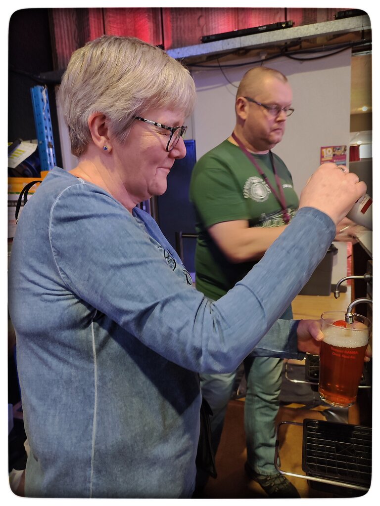 Pouring a pint at Oldham Beer & Cider Festival April 2024