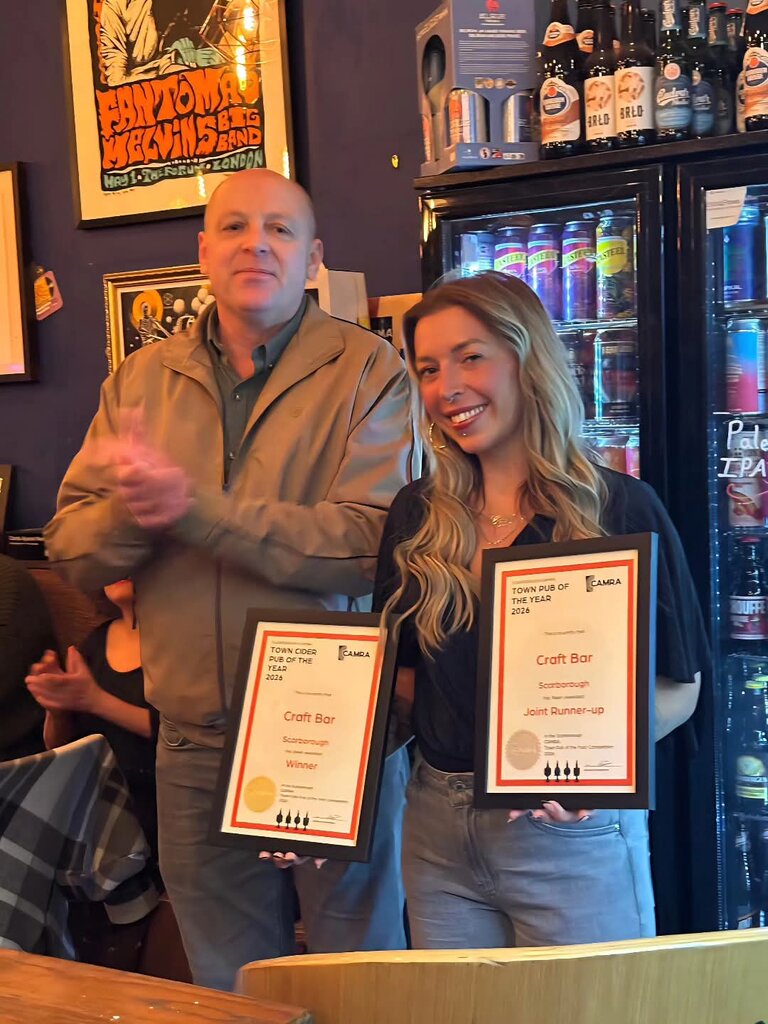 Landlady Katrice receives double awards from branch chairman Mike Stock