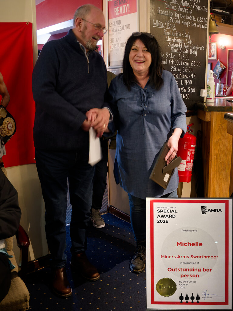Terry Ridal from Furness CAMRA presents Michelle from the Miners Arms, Swarthmoor with the certificate for 'Outstanding Bar Person'. Michelle knows just how to serve their cask ale and won't let a sub-standard pint escape!