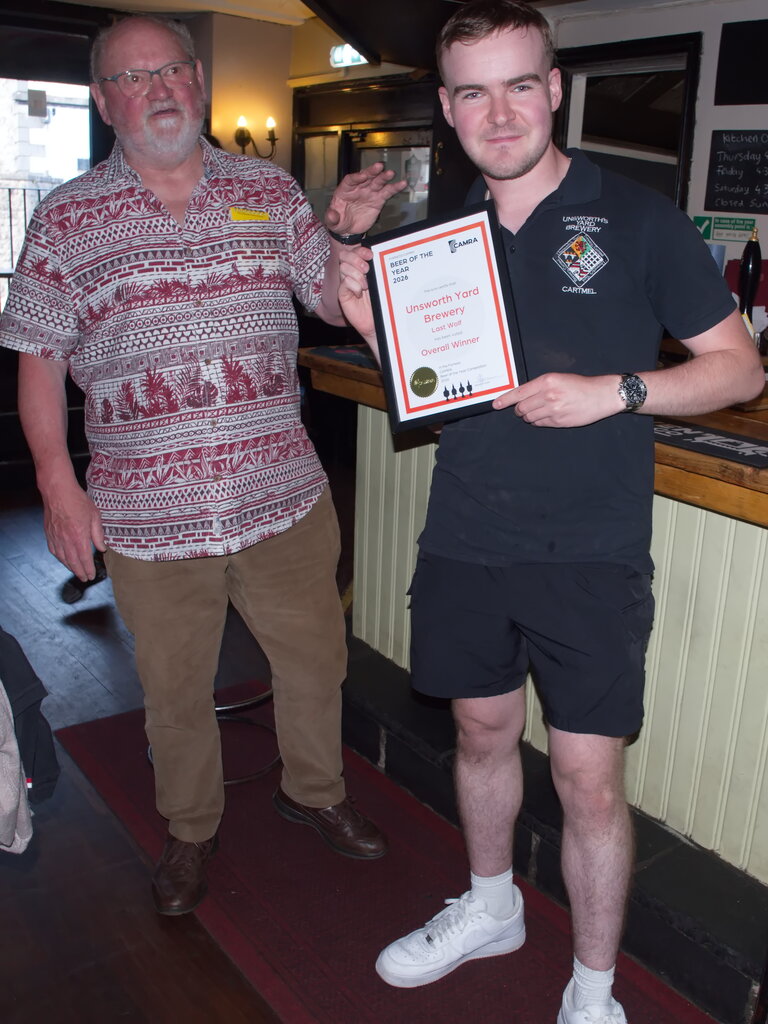 Freddy Rogers receives the certificate for the Furness CAMRA 'Beer of the Year 2026 award - Unsworth's Yard  Last Wolf (Sir Edgar Harrington's Last Wolf to be accurate). Presenting the certificate is Furness's own, Stephen ('Lou') Lewis