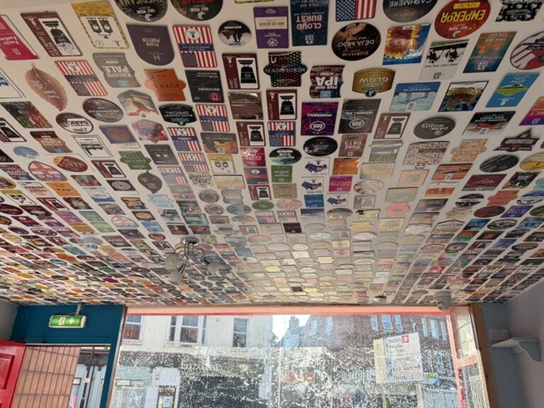 The ceiling features pump clips from just some of the hundreds of beers served since opening. The ceiling features pump clips from just some of the hundreds of beers served since opening.