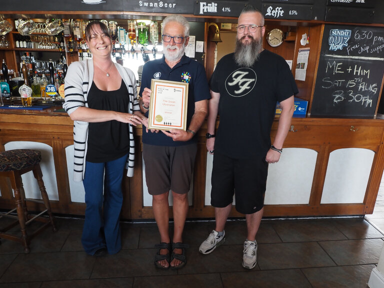 Sarah and Lewis receive the Certificate for Cumbria Pub of the Year 2026 from Cumbria Area Organiser, Stephen Walker.