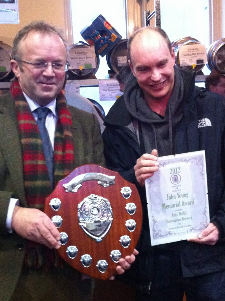 Torquil Sligo-Young (left) presents Andy Moffat with his award