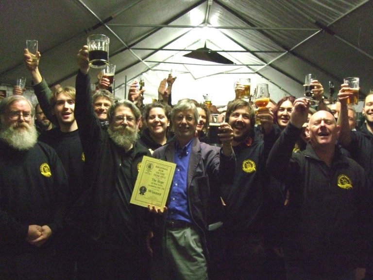 Regional Director John Cryne raises a toast with staff to celebrate The Hope, Carshalton being London's 2012 Pub of the Year.